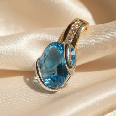 14K two-tone gold blue topaz and diamond pendant, three-quarter angle