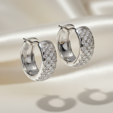 18K White Gold 0.64ctw Diamond Wide Pavé Huggie Hoop Earrings – Three-Quarter View