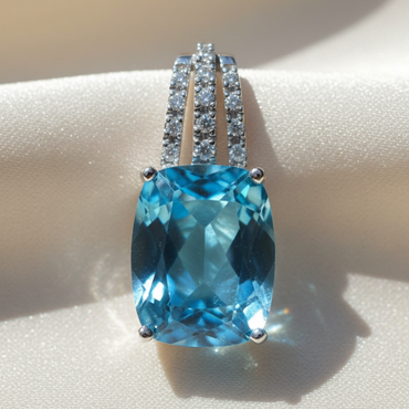 14K white gold cushion blue topaz and diamond triple bail pendant, front view