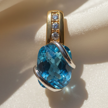14K two-tone gold blue topaz and diamond pendant, front view