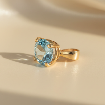 14K yellow gold 3.69CT blue topaz solitaire pendant, three-quarter angle