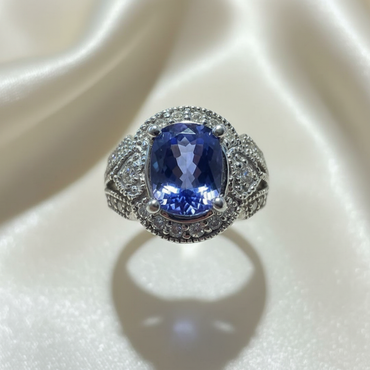 14K White Gold 6x4mm Oval Tanzanite Ring with Diamond Halo & Open Filigree Scroll Shank - Top Down View
