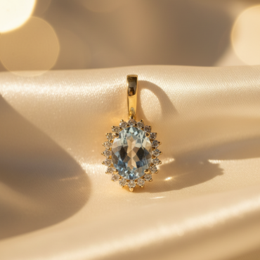 14K Yellow Gold Oval Aquamarine and Diamond Halo Enhancer Pendant - front view on cream satin