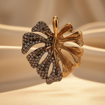 14K yellow gold .60ctw champagne diamond two-tone monstera leaf pendant with chain, front view