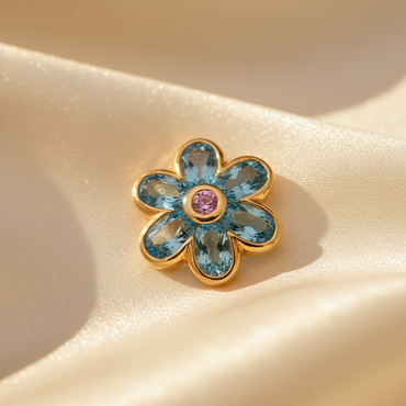 14K yellow gold blue topaz and pink sapphire flower pendant, elevated angle