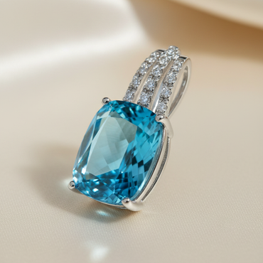 14K white gold cushion blue topaz and diamond triple bail pendant, three-quarter angle