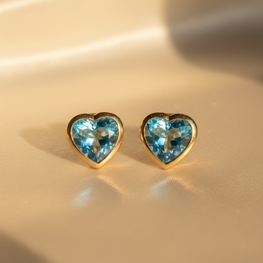14K yellow gold heart blue topaz bezel stud earrings - editorial marketing image 2