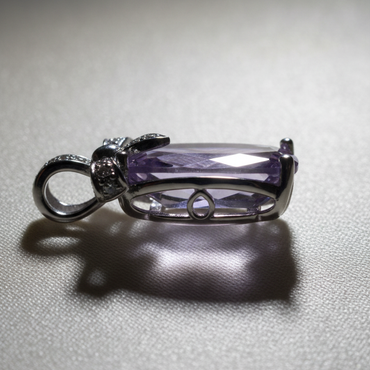 14K White Gold Cushion Amethyst and Diamond Bow Pendant - side profile on cream satin
