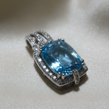 14K white gold cushion blue topaz and diamond halo pendant, three-quarter angle
