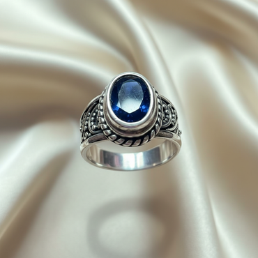 Sterling Silver Oval Blue Sapphire Bali Ring — top-down sapphire and rope bezel view