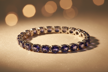 Sterling silver oval tanzanite and diamond tennis bracelet on cream satin, editorial luxury photography