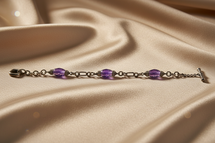 Sterling silver amethyst and diamond station chain bracelet on cream satin, editorial luxury photography