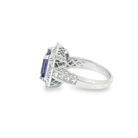 Halo Tanzanite And Diamond Ring
