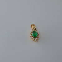 Oval Emerald & Diamond Halo Pendant in 14K Yellow Gold
