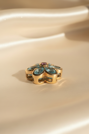 14K yellow gold blue topaz and pink sapphire flower pendant, side view