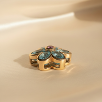 14K yellow gold blue topaz and pink sapphire flower pendant, side view
