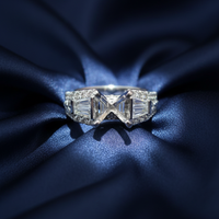 14K White Gold Baguette and Pavé Diamond Semi-Mount Engagement Ring on midnight blue silk backdrop editorial marketing image
