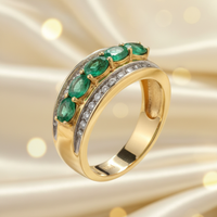 14K yellow gold five-stone emerald and .25ctw diamond channel ring, side view