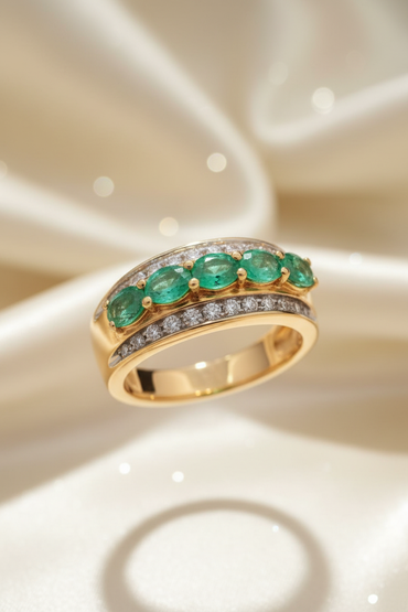 14K yellow gold five-stone emerald and .25ctw diamond channel ring, elevated front view