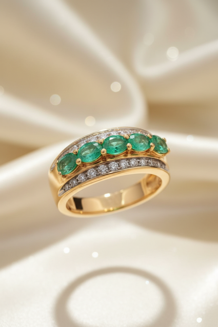 14K yellow gold five-stone emerald and .25ctw diamond channel ring, elevated front view