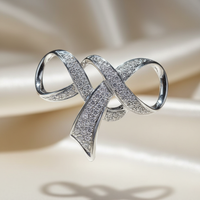 14K white gold diamond ribbon bow slide pendant editorial marketing image