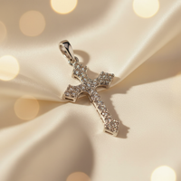 10K white gold diamond-encrusted cross pendant with round brilliant pavé diamonds and flared pointed tips, angle 3