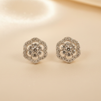 10K white gold pavé diamond camellia flower cluster stud earrings with round brilliant diamonds, angle 1