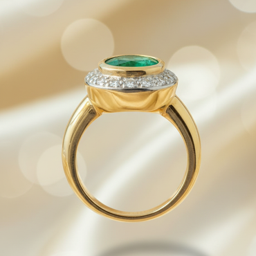 14K yellow gold oval emerald bezel-set diamond pavé halo ring, side profile view