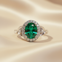 14K White Gold Oval Emerald & Diamond Halo Ring - editorial close up