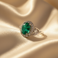 14K White Gold Oval Emerald & Diamond Halo Ring - editorial three quarter