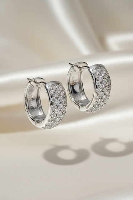 18K White Gold 0.64ctw Diamond Wide Pavé Huggie Hoop Earrings – Three-Quarter View