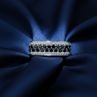10K White Gold Men's Black and White Diamond Band Ring on midnight blue silk backdrop editorial marketing image