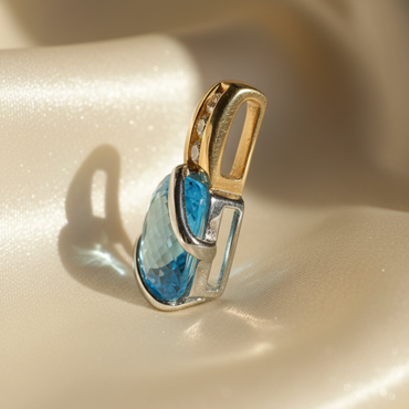 14K two-tone gold blue topaz and diamond pendant, side profile
