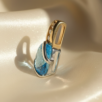14K two-tone gold blue topaz and diamond pendant, side profile