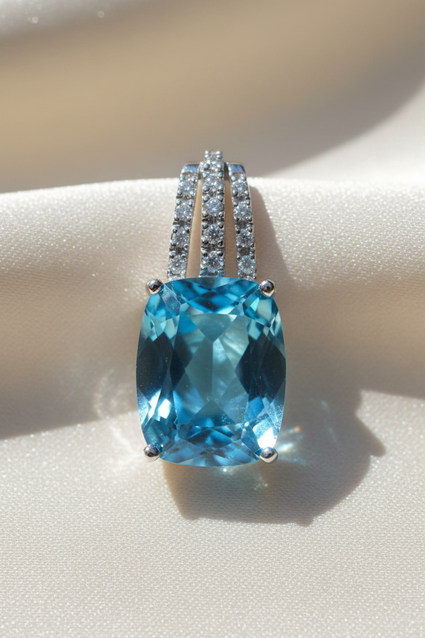 14K white gold cushion blue topaz and diamond triple bail pendant, front view