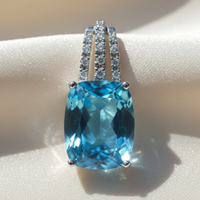 14K white gold cushion blue topaz and diamond triple bail pendant, front view