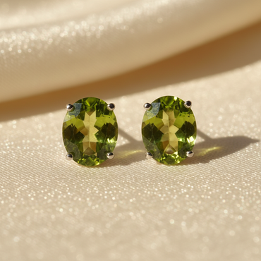 14K white gold oval peridot stud earrings 8x6mm - editorial marketing image 1