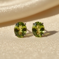 14K white gold oval peridot stud earrings 8x6mm - editorial marketing image 1