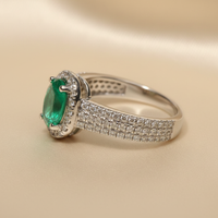 18K White Gold Oval Emerald & Diamond Halo Ring - editorial angled side