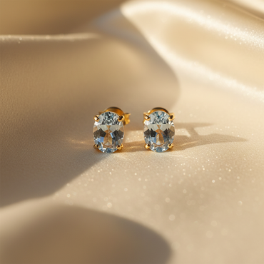 14K yellow gold oval aquamarine stud earrings - editorial marketing image 2