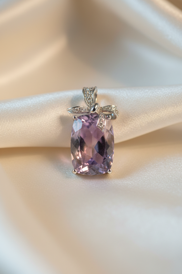 14K White Gold Cushion Amethyst and Diamond Bow Pendant - front view on cream satin