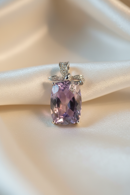14K White Gold Cushion Amethyst and Diamond Bow Pendant - front view on cream satin