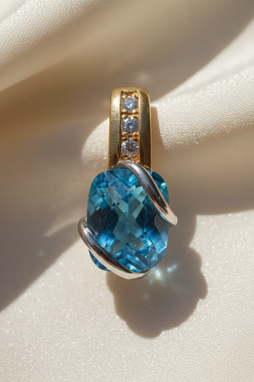 14K two-tone gold blue topaz and diamond pendant, front view
