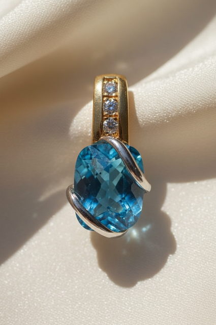 14K two-tone gold blue topaz and diamond pendant, front view
