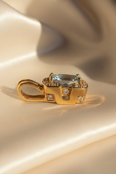 18K Yellow Gold Oval Aquamarine and Diamond Pendant - side profile, cream satin