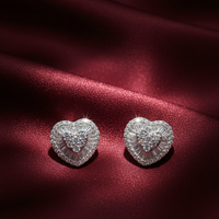 14K White Gold Diamond Heart Cluster Halo Stud Earrings on crimson silk backdrop editorial marketing image
