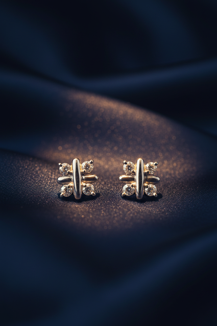 14K White Gold Diamond Cross Bar Stud Earrings on midnight blue silk backdrop editorial marketing image