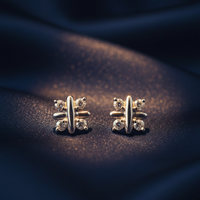 14K White Gold Diamond Cross Bar Stud Earrings on midnight blue silk backdrop editorial marketing image