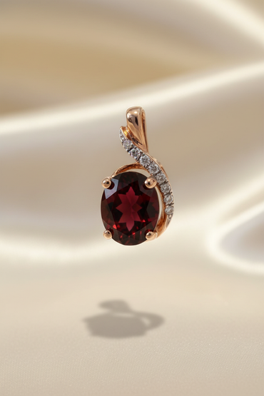 14K rose gold oval garnet and diamond pendant front view