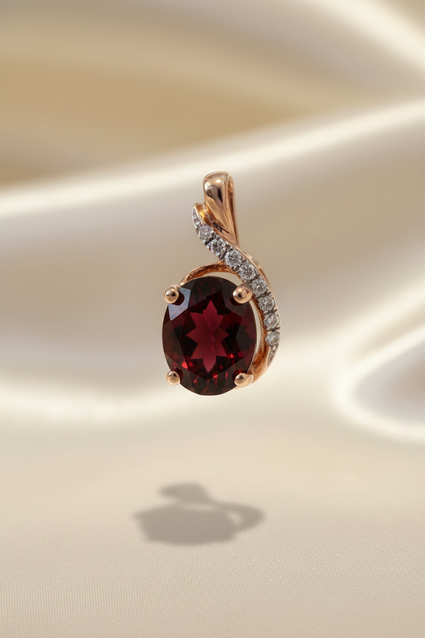 14K rose gold oval garnet and diamond pendant front view